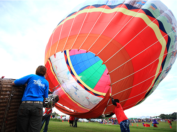 Heating up the air inside the balloon with the burner